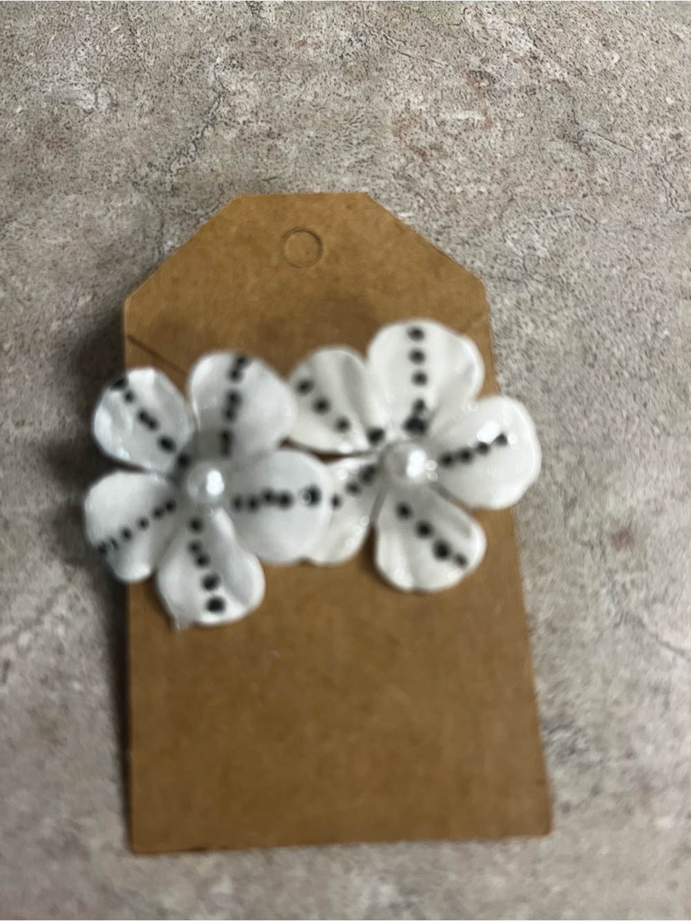 White Floral Petal Stud Earrings with Black Dot Detail